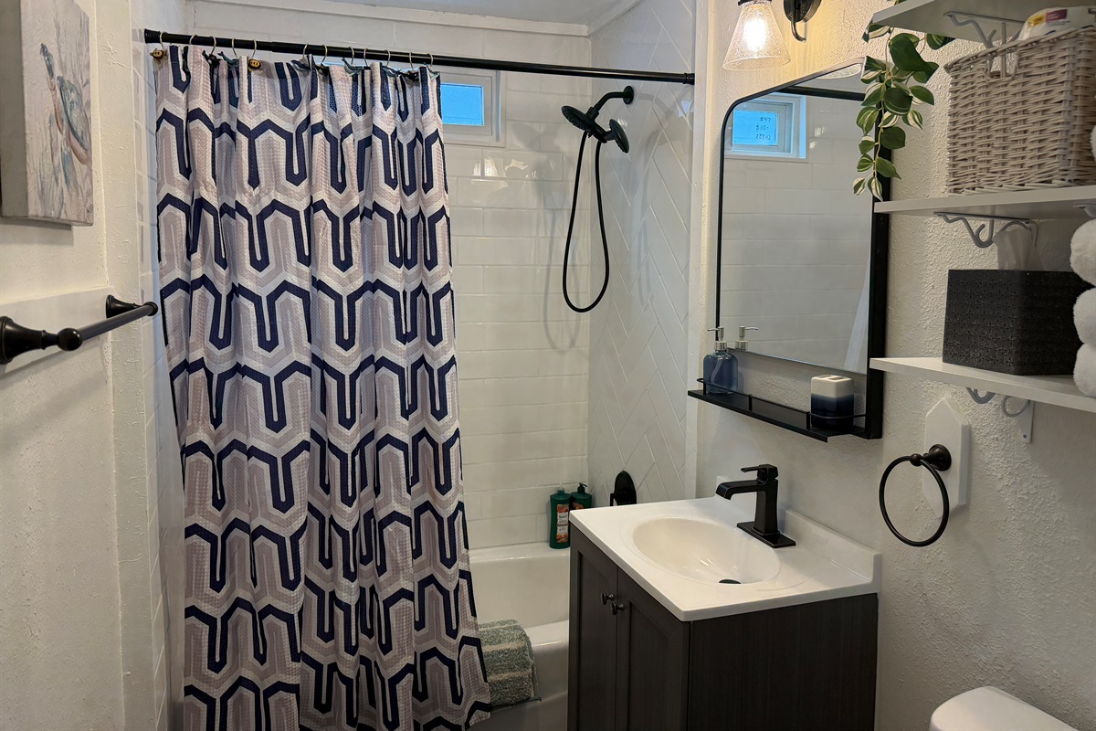 Aspen offers a full bathroom with hand-held shower and tub.