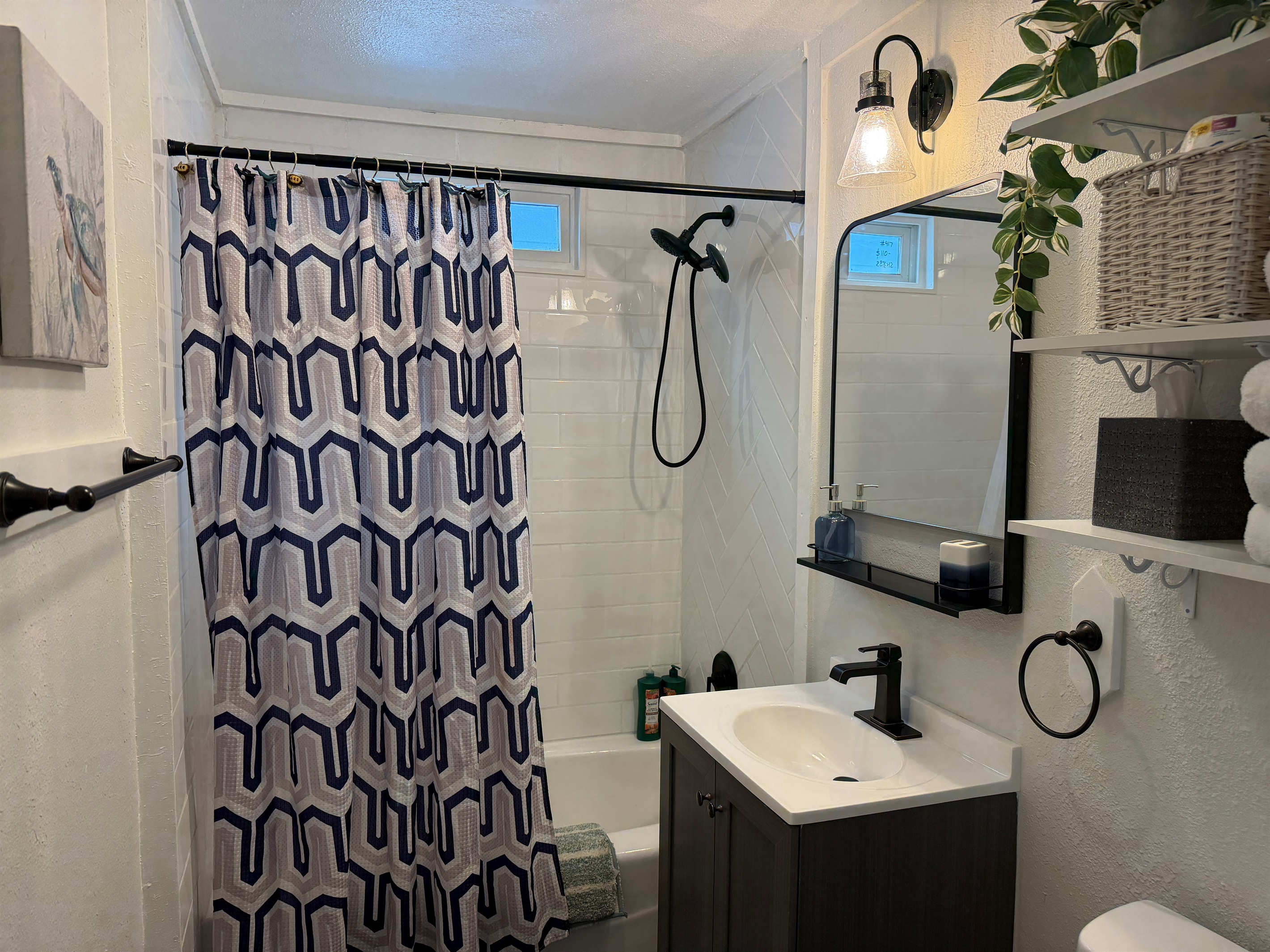 Aspen offers a full bathroom with hand-held shower and tub.