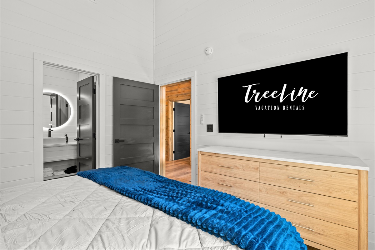 Thoughtfully designed with comfort in mind, this inviting bedroom offers stylish finishes and easy access to the nearby bathroom for added convenience.