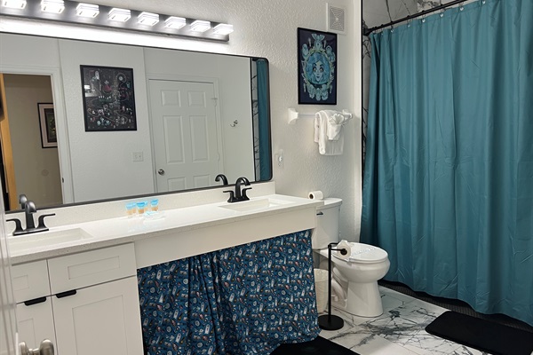 Second bath attached to Suite 2 and also with access from hall.