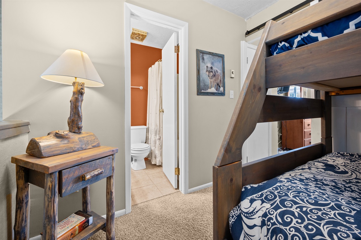 View showing the bunk area and convenient access to the nearby bathroom.