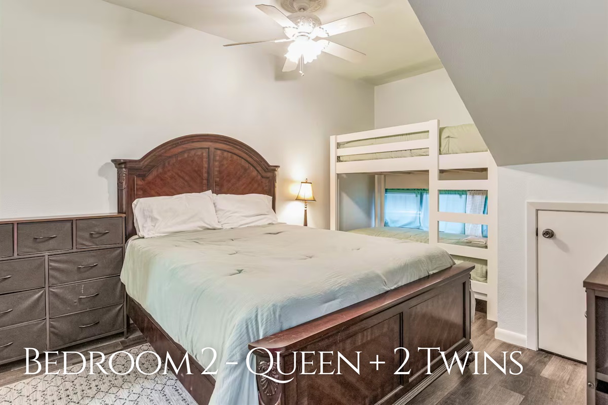 The second bedroom offers a queen bed and bunks, making it perfect for families or groups.