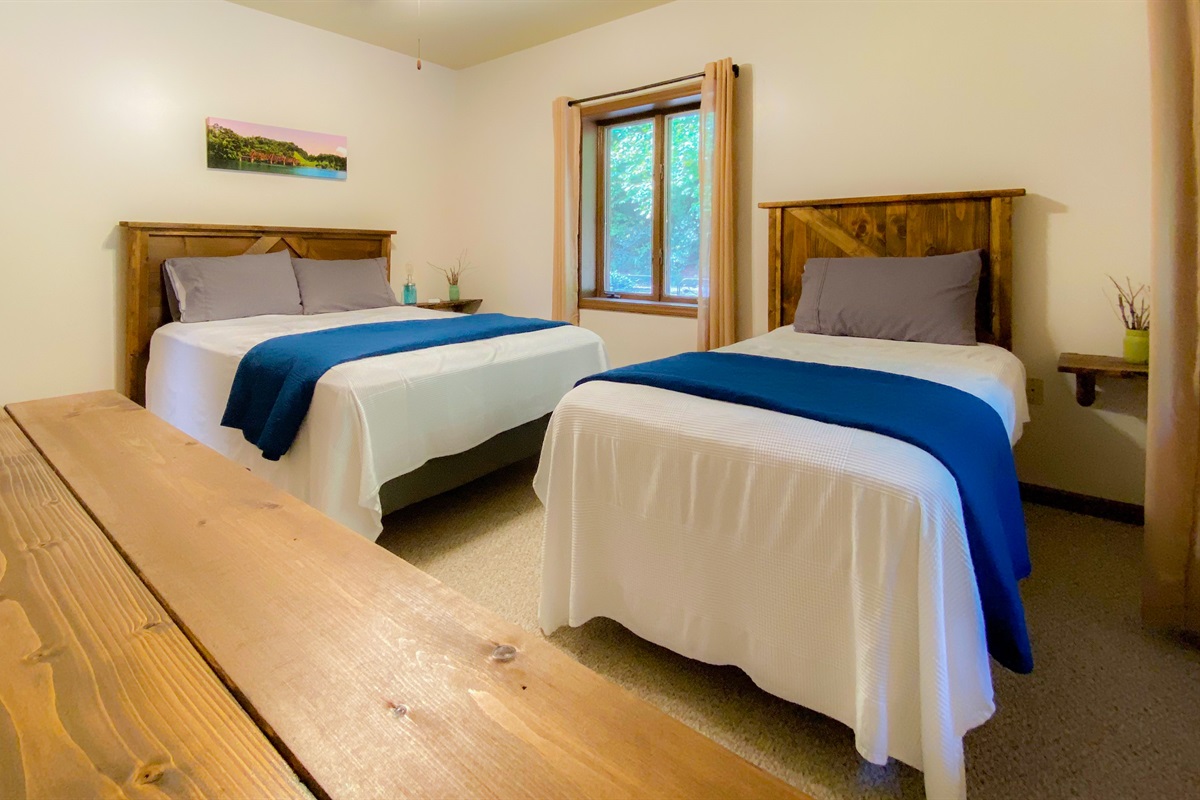 With many scenic drives in the area we had to theme a bedroom in that fashion! one queen and one twin bed in this bedroom on the upper level of the Hive Lodge