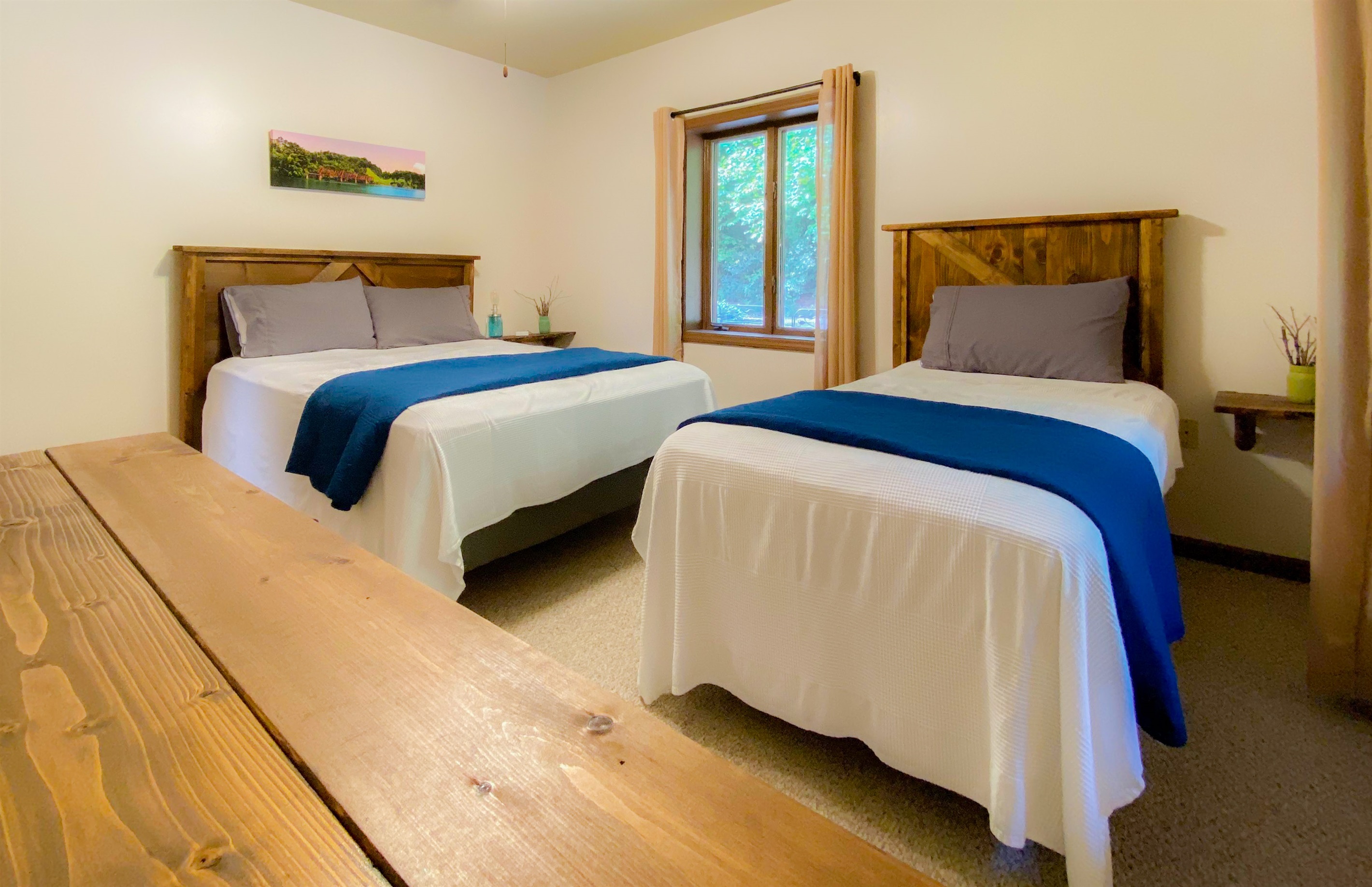 With many scenic drives in the area we had to theme a bedroom in that fashion! one queen and one twin bed in this bedroom on the upper level of the Hive Lodge