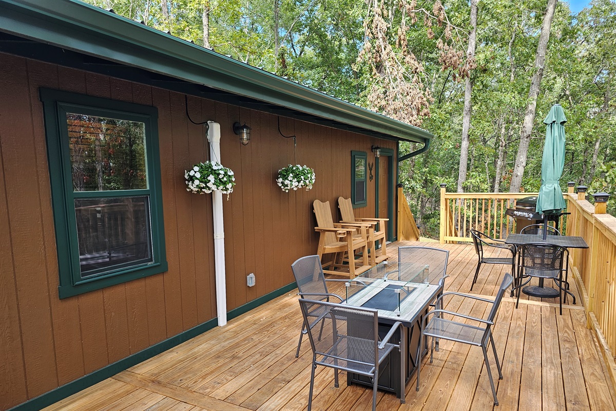 Enjoy outdoor living with comfy seating, a fire table, and fresh forest air — the perfect place to gather and relax