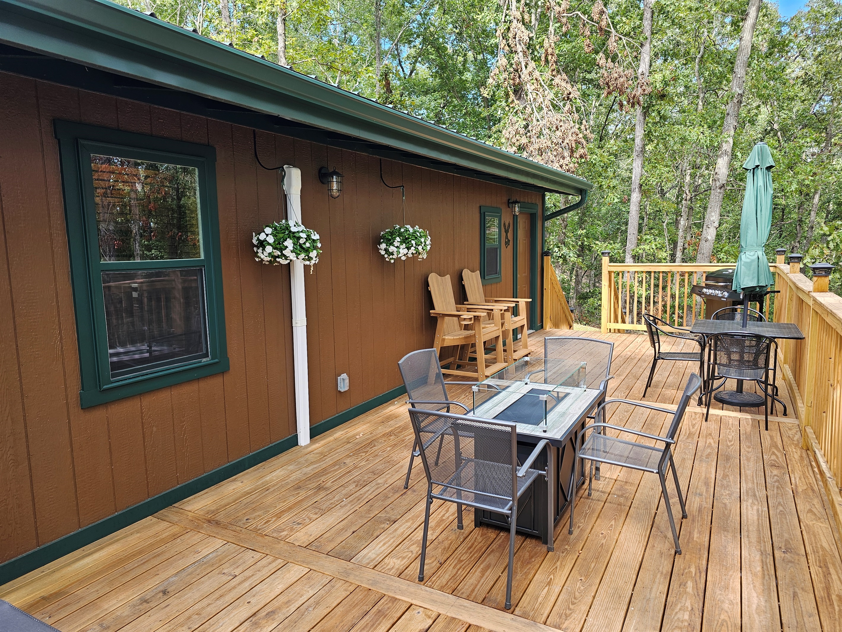 Enjoy outdoor living with comfy seating, a fire table, and fresh forest air — the perfect place to gather and relax