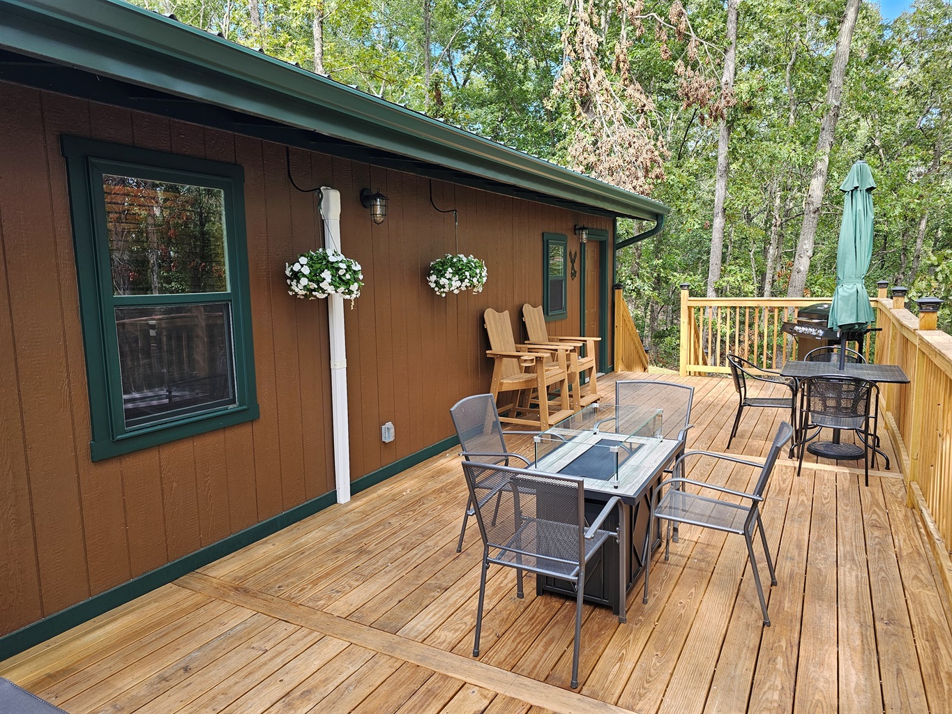 Enjoy outdoor living with comfy seating, a fire table, and fresh forest air — the perfect place to gather and relax