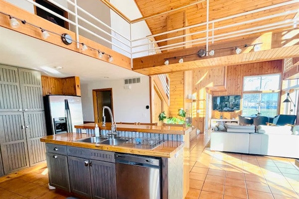 Open concept living area with vaulted ceilings and plenty of space to gather.