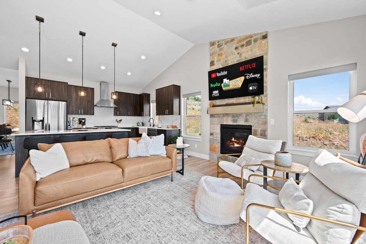 Designed for entertaining, the expansive living area seamlessly connects the kitchen, dining room, and great room.