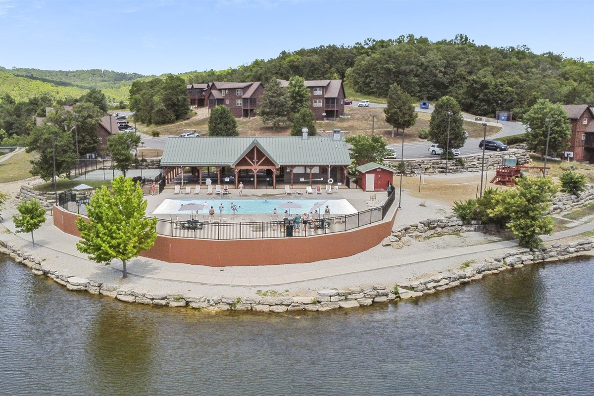 Outdoor community pool by the small lake!