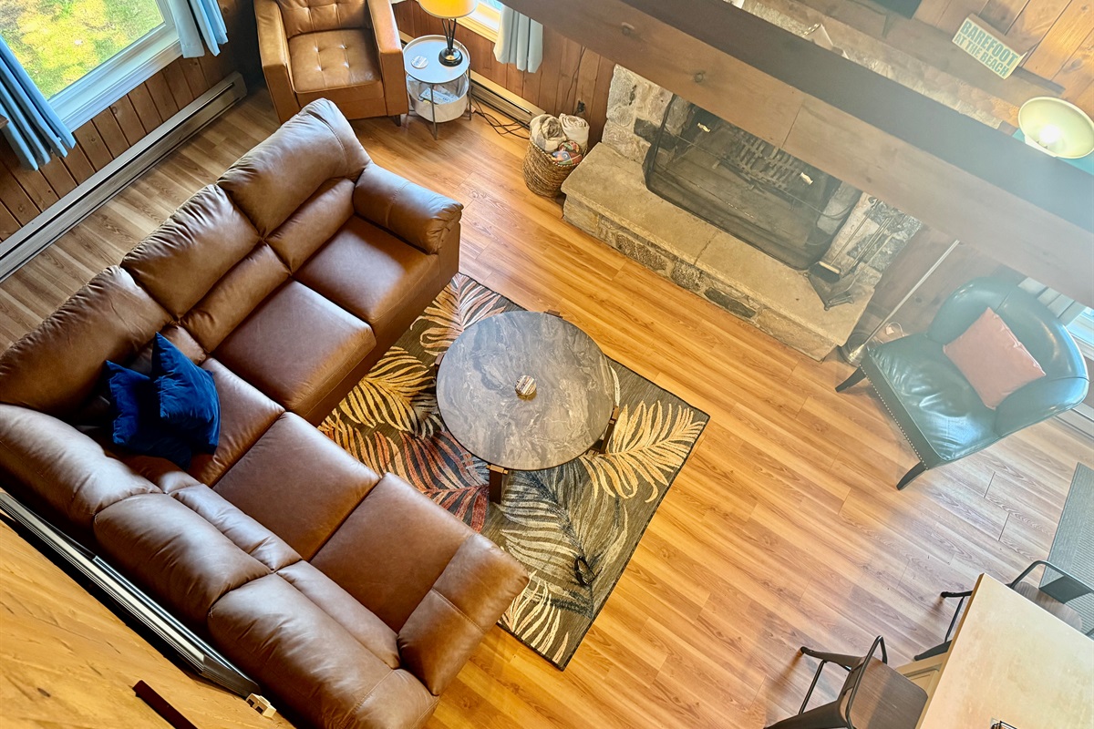 Living Room with fireplace and lake views