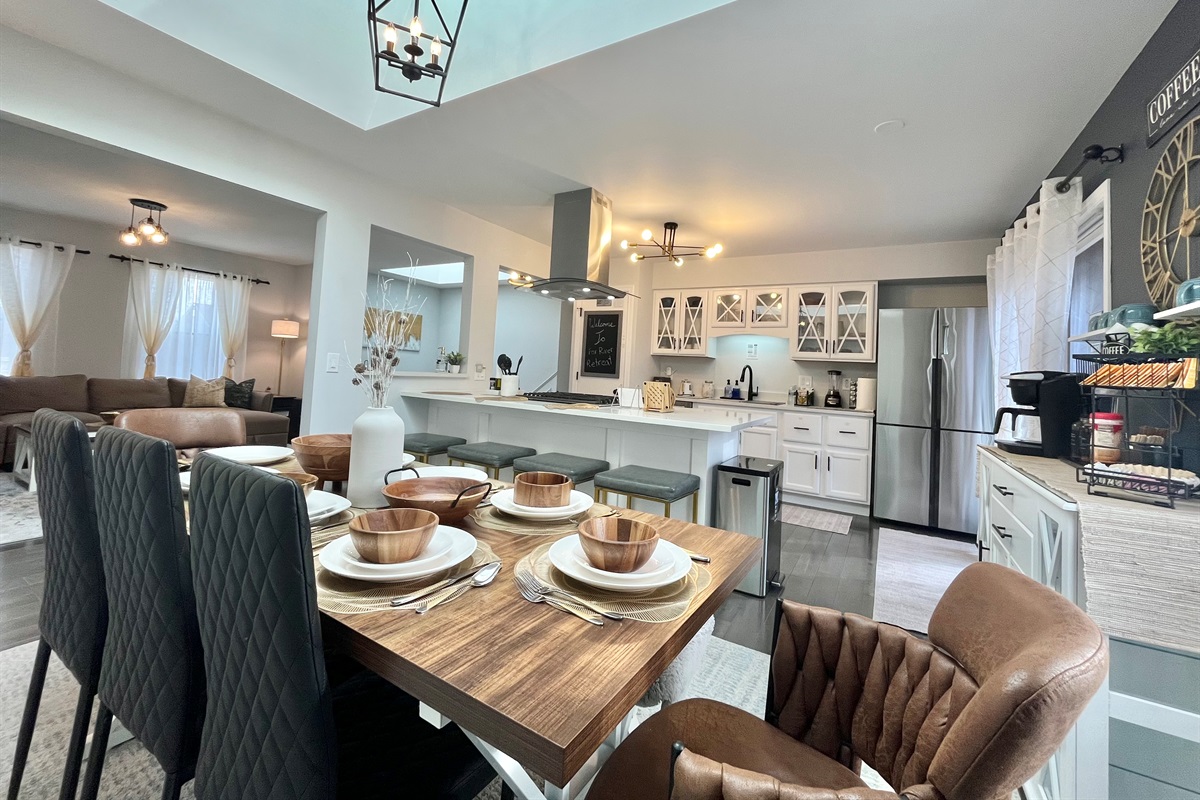 Open Kitchen opening to dining with island and skylight, Lots of natural light