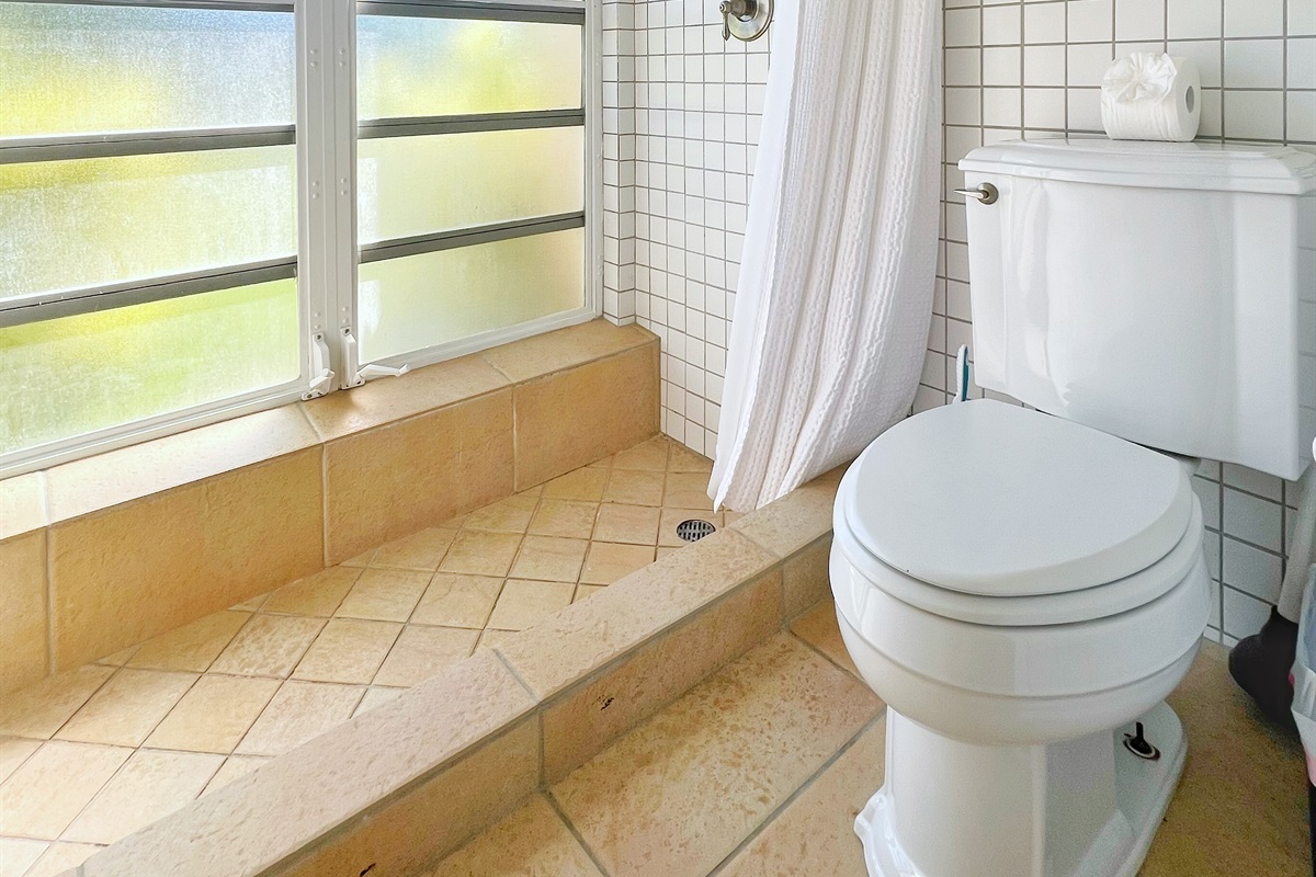 A sleek and modern bathroom designed with convenience in mind.