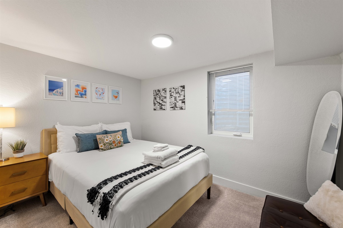 Full-size bedroom with minimalist design and natural light