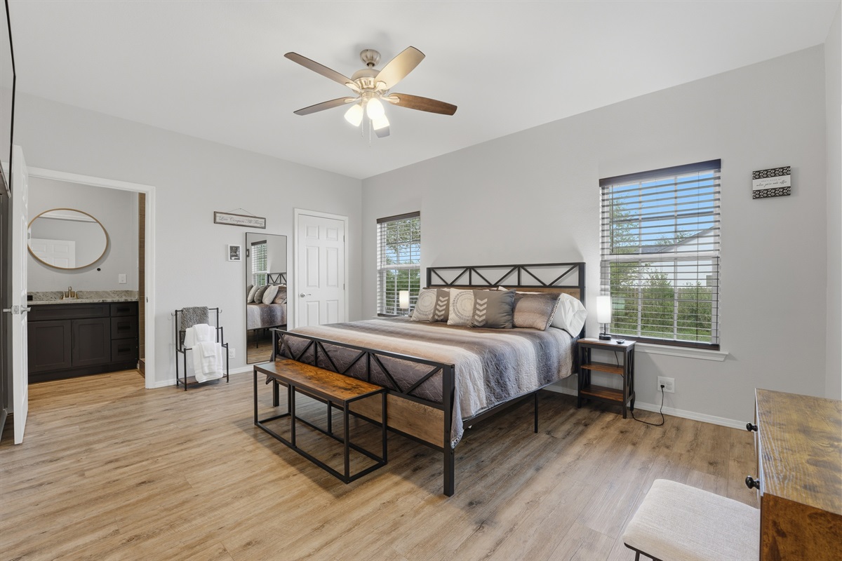 Primary king suite with luxury mattress, en-suite bath & porch access