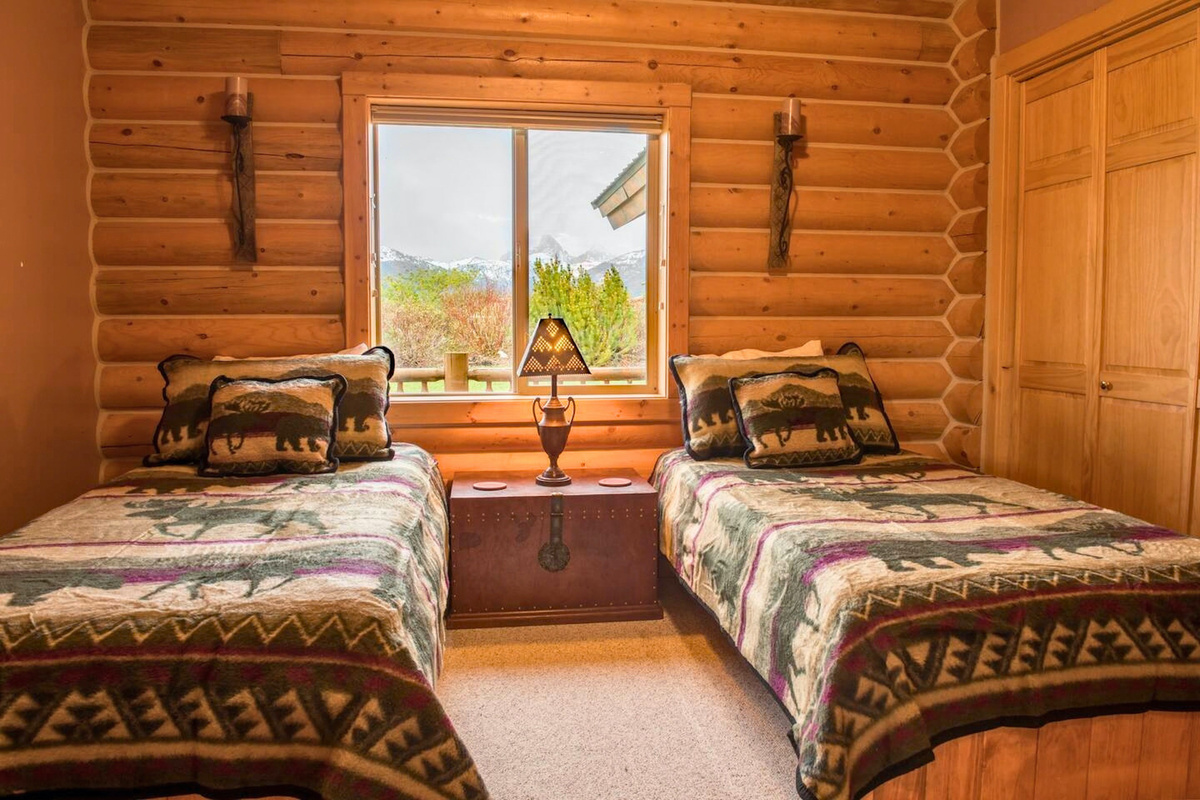 The tasteful second bedroom is the perfect place for kids or extra guests to rest comfortably.