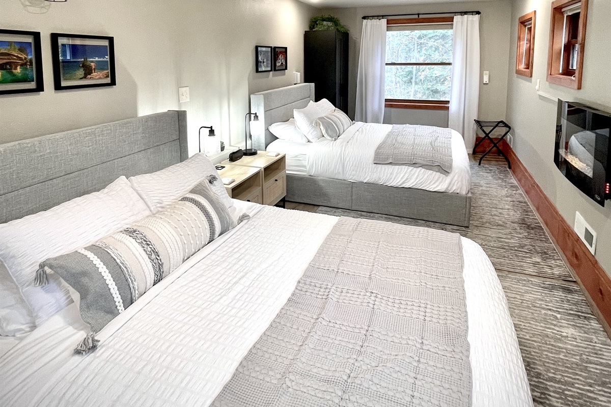 2 bed queen- Main bedroom lower level to the right as you walk in - *note you must take stairs to access loft style kitchen living bath**  added electric fireplace and seating area surrounded by 7 windows & plenty of natural light