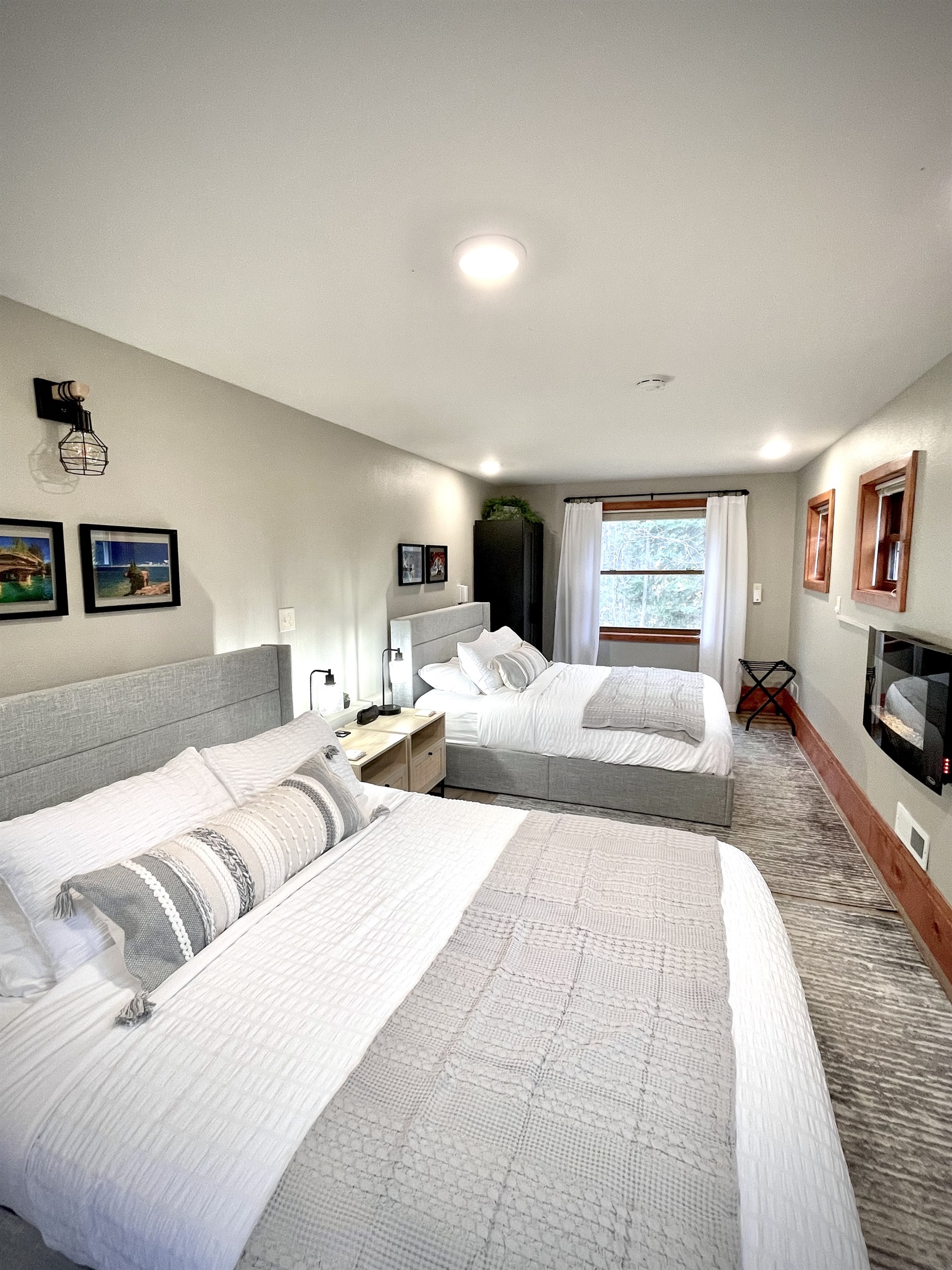2 bed queen- Main bedroom lower level to the right as you walk in - *note you must take stairs to access loft style kitchen living bath**  added electric fireplace and seating area surrounded by 7 windows & plenty of natural light