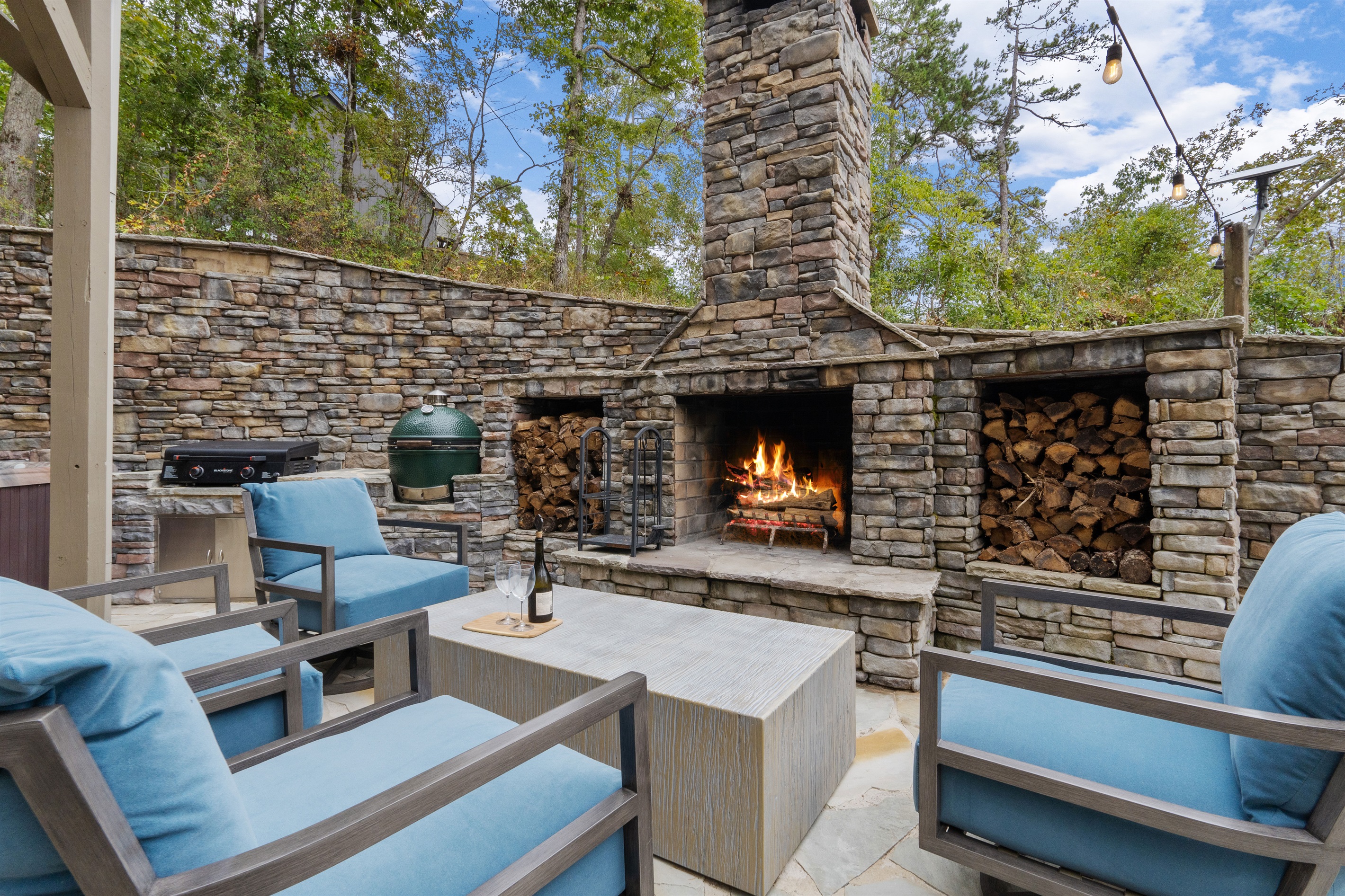 Gather around the outdoor fireplace, perfect for cool evenings and cozy conversations under the stars.