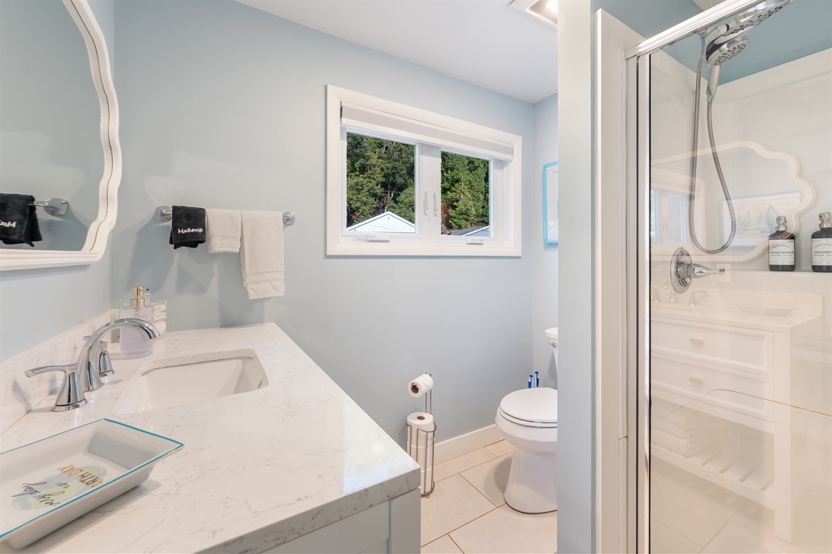 Access the convenient main level bath while you're outside. enjoying the lake. It's perfect to throw the little ones into the 48" shower after a day in the sun and sand!