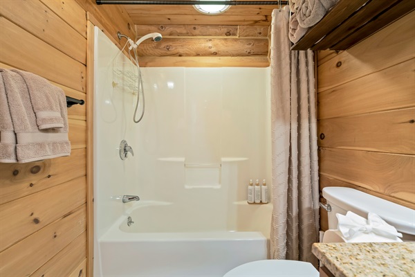 Modern full bath with tub and shower for a relaxing experience.