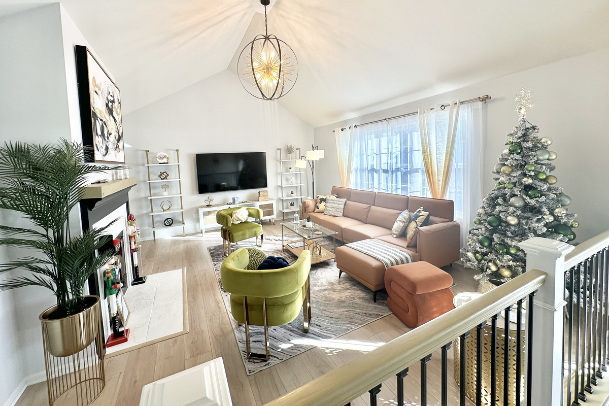 Beautiful living room with soaring vaulted ceilings. A festive Christmas tree will be set up for the holiday season! 🎄