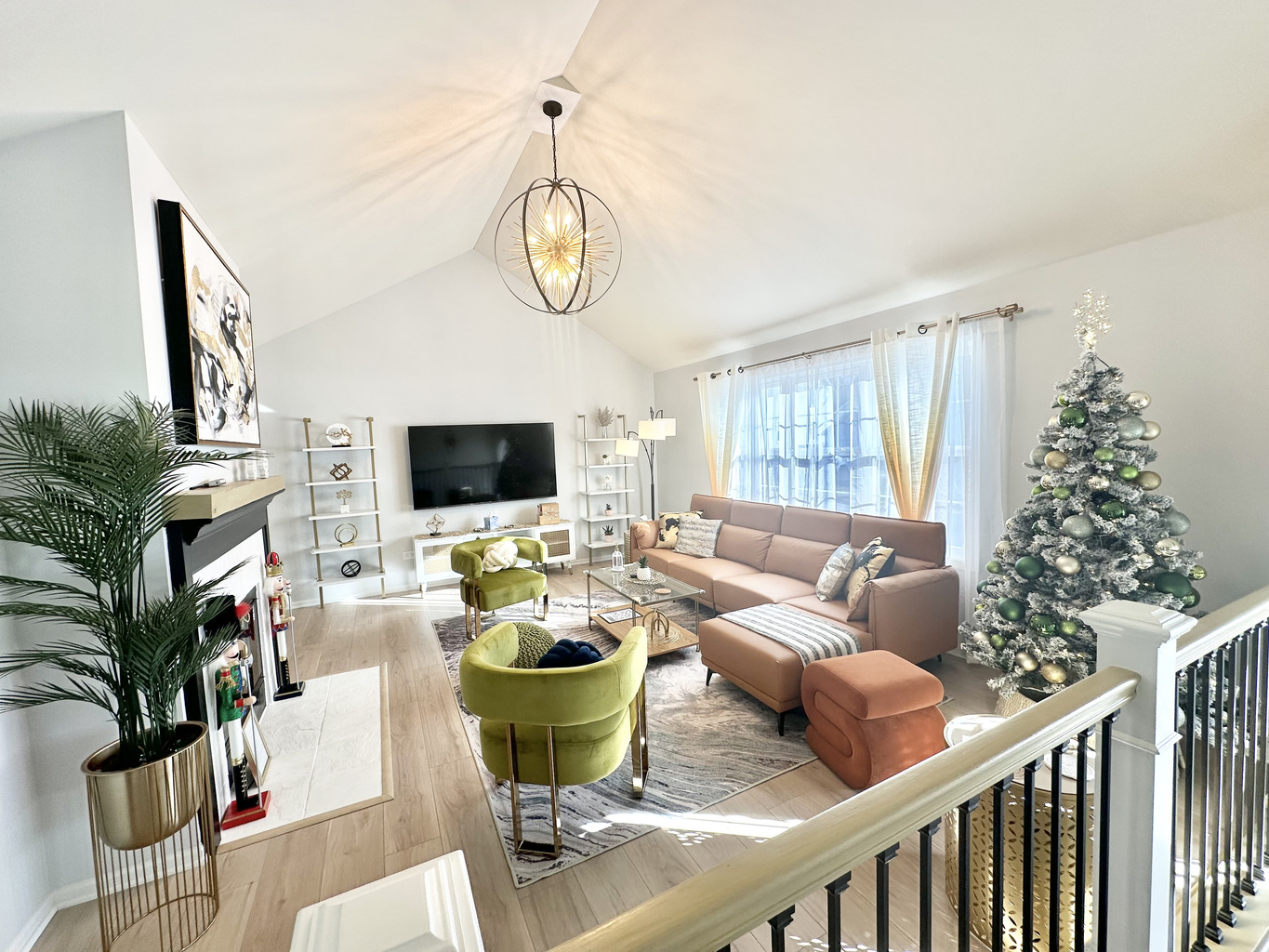 Beautiful living room with soaring vaulted ceilings. A festive Christmas tree will be set up for the holiday season! 🎄