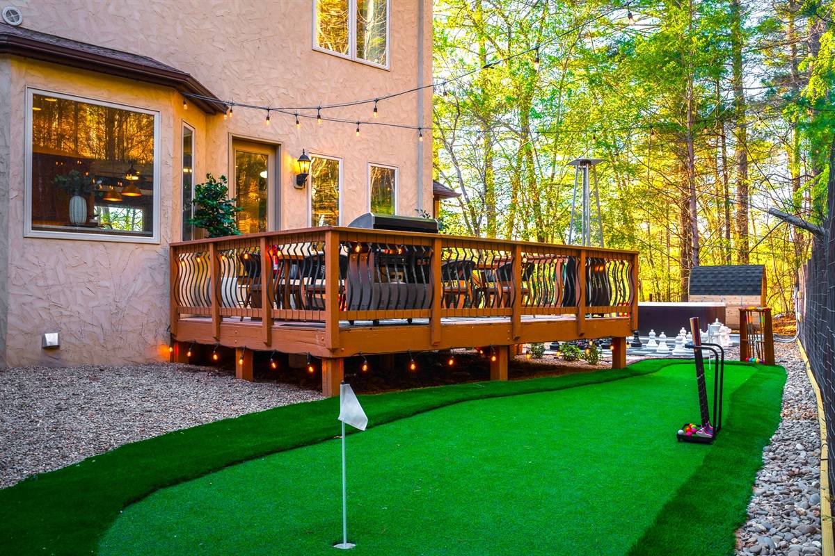 Elevated deck overlooking mini putt and outdoor space - perfect for relaxing while kids and groups stay entertained