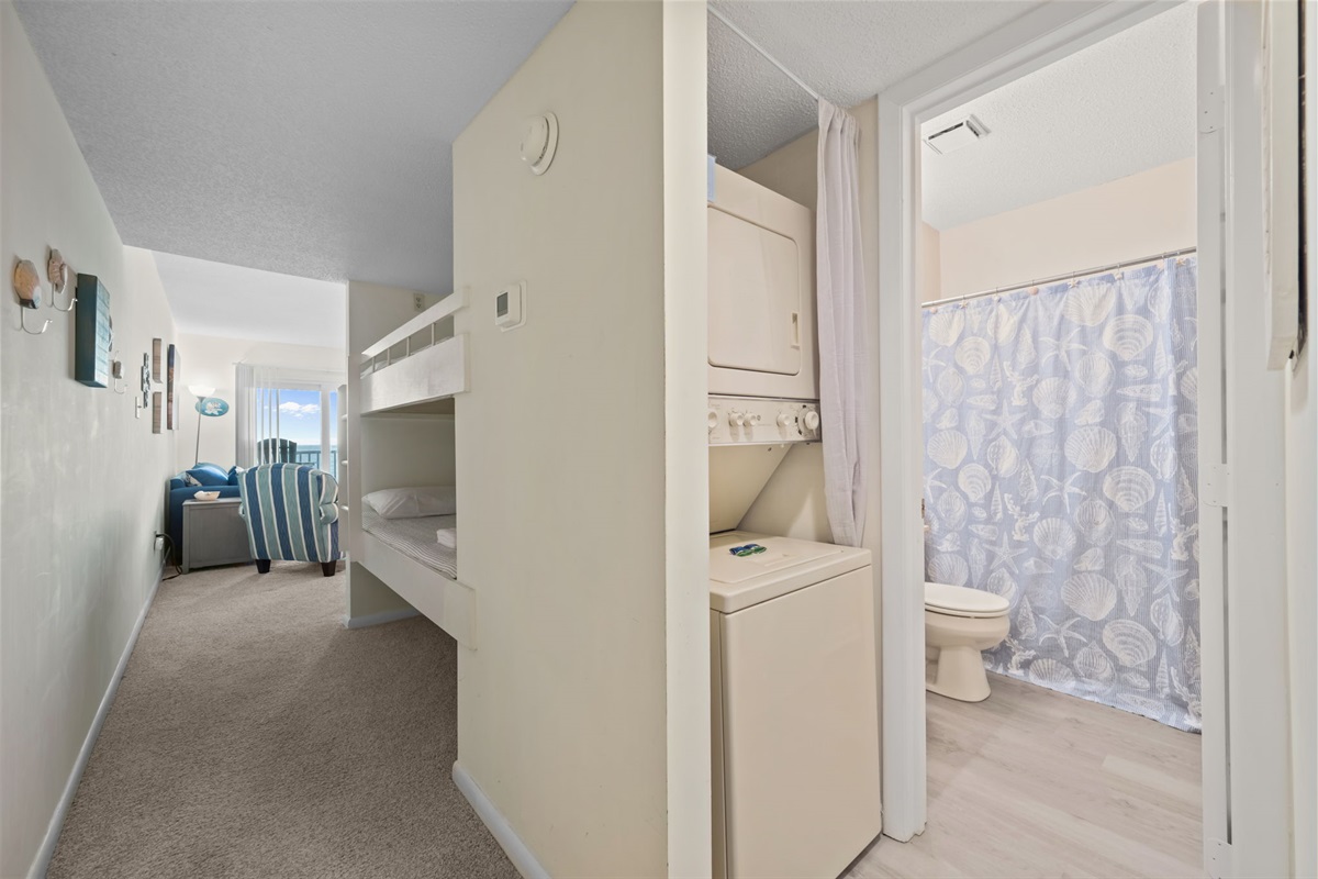 Hallway layout with built-in bunk nook, in-unit washer/dryer, and a full bath&mdash;everything thoughtfully tucked away for easy beach living