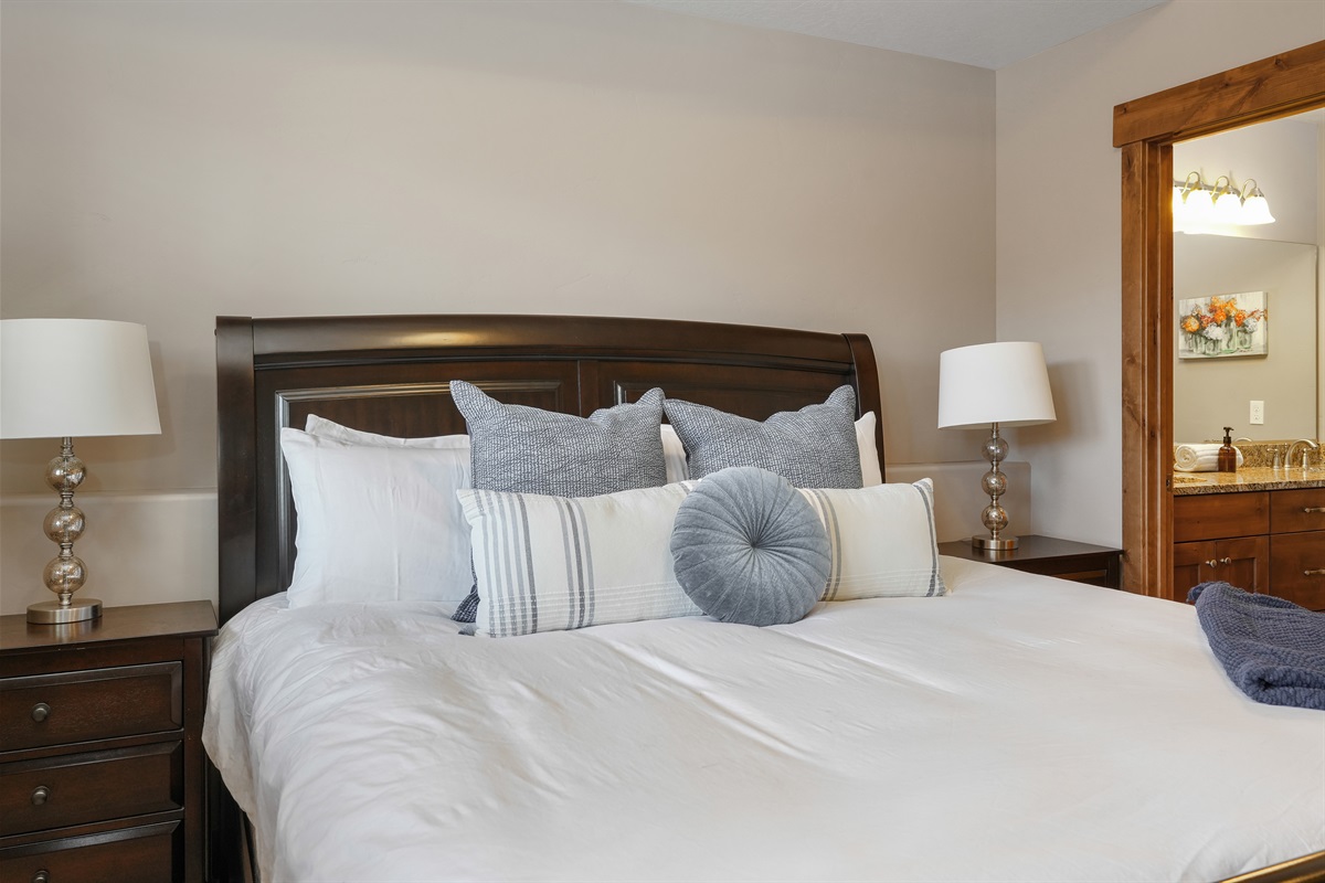 Soft textures and warm tones make this bedroom feel like home the moment you walk in.