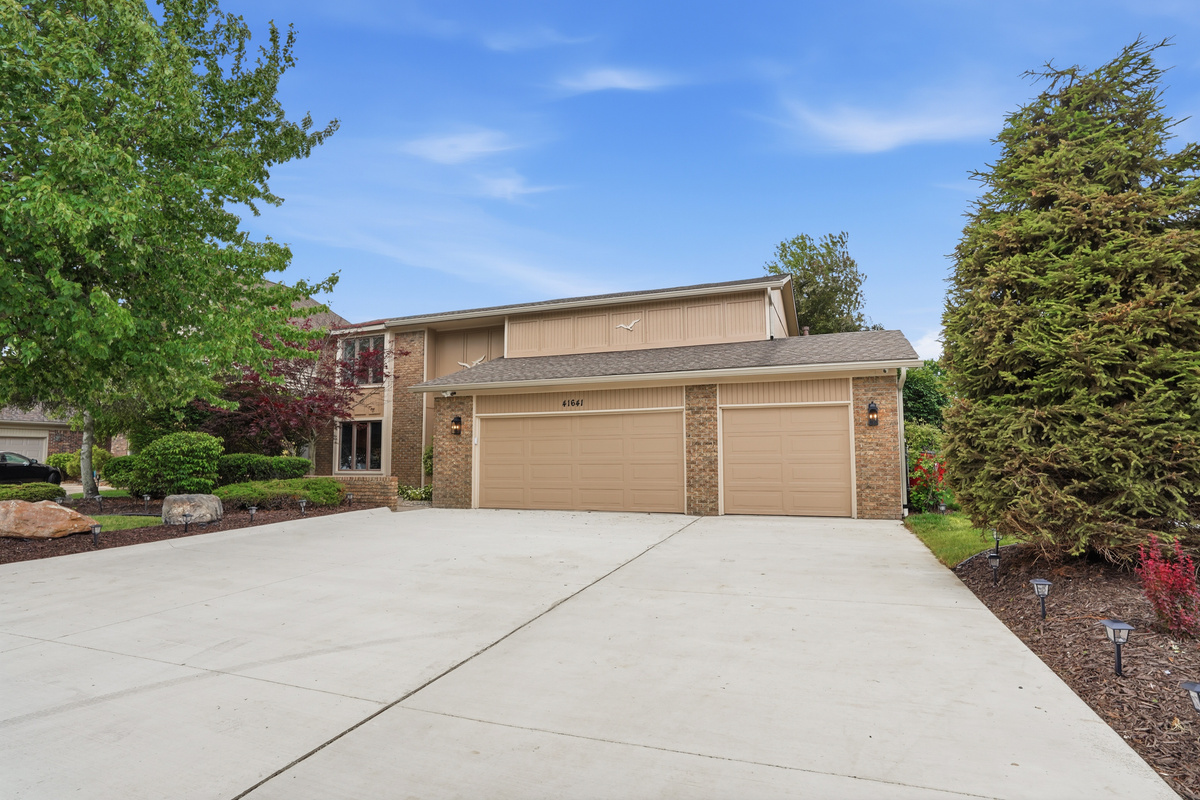Clean, spacious home with a wide driveway and attached garage. Quiet suburban setting with well-maintained exterior ideal for comfortable, easy living and convenient parking.