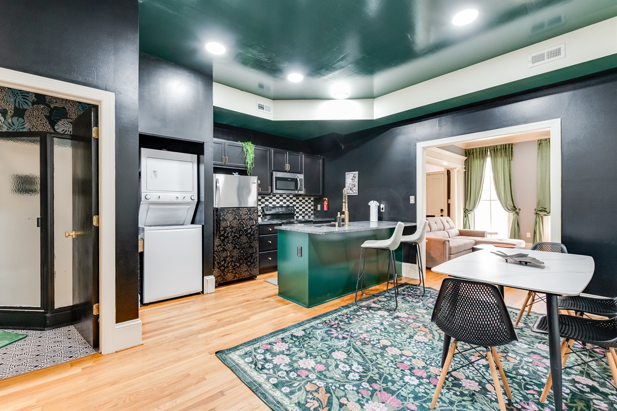 Chic Kitchen & Dining: Sleek finishes and vibrant decor create a lively space for culinary adventures!