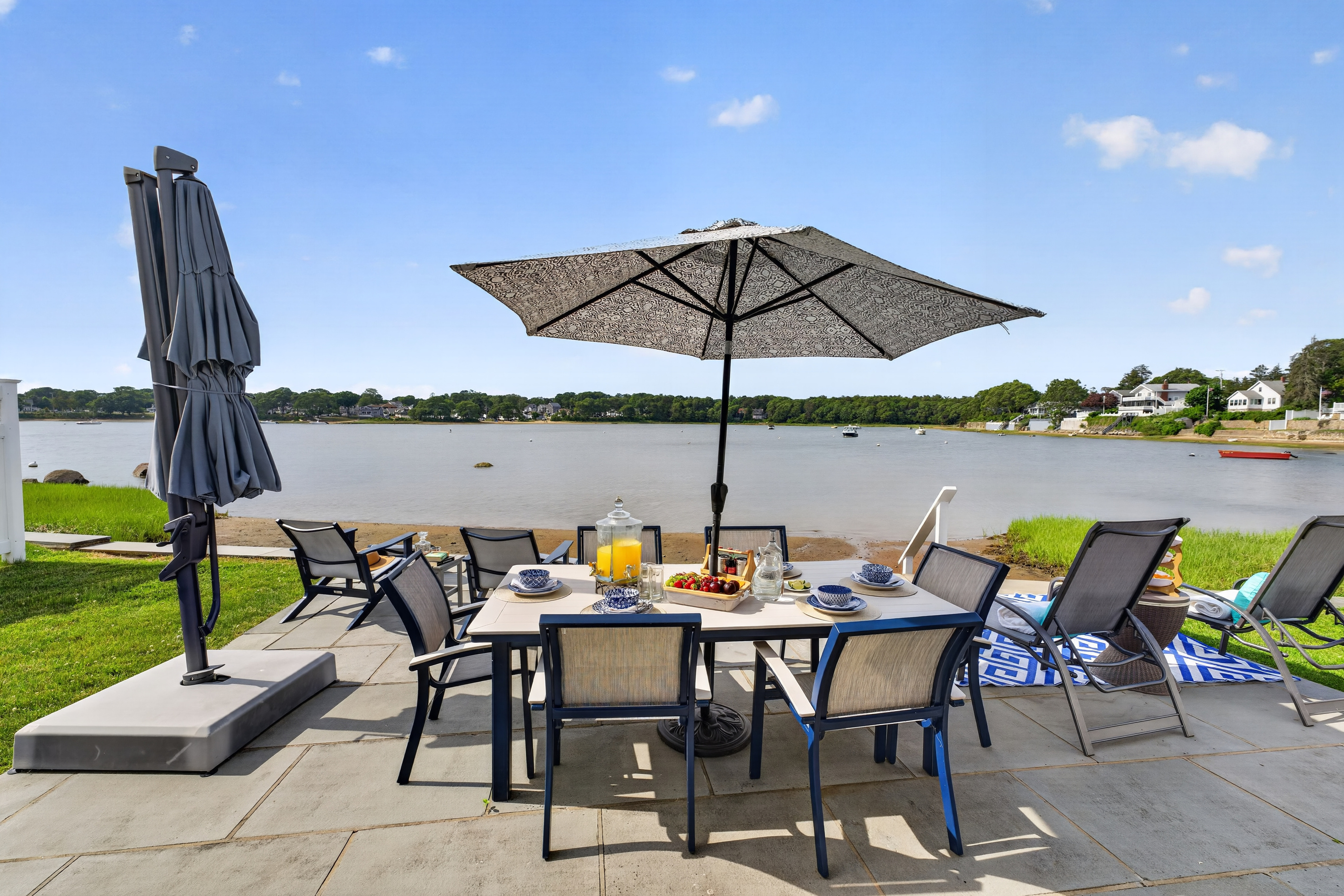 Gather around the outdoor dining table for meals with beautiful views of the water.