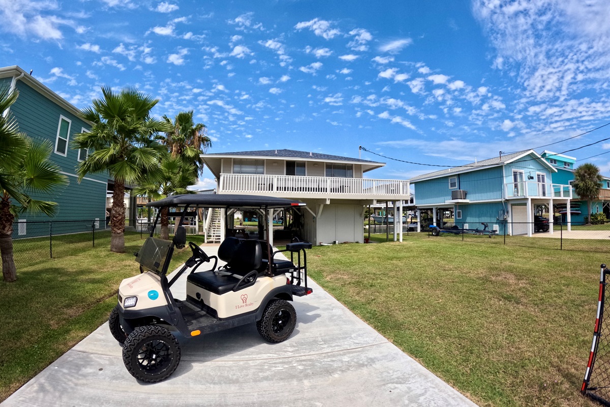 Front of the home with golf cart