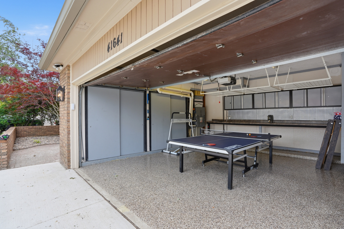 The covered patio area further expands the usable square footage, creating an inviting outdoor extension that seamlessly connects the indoor and outdoor living spaces.