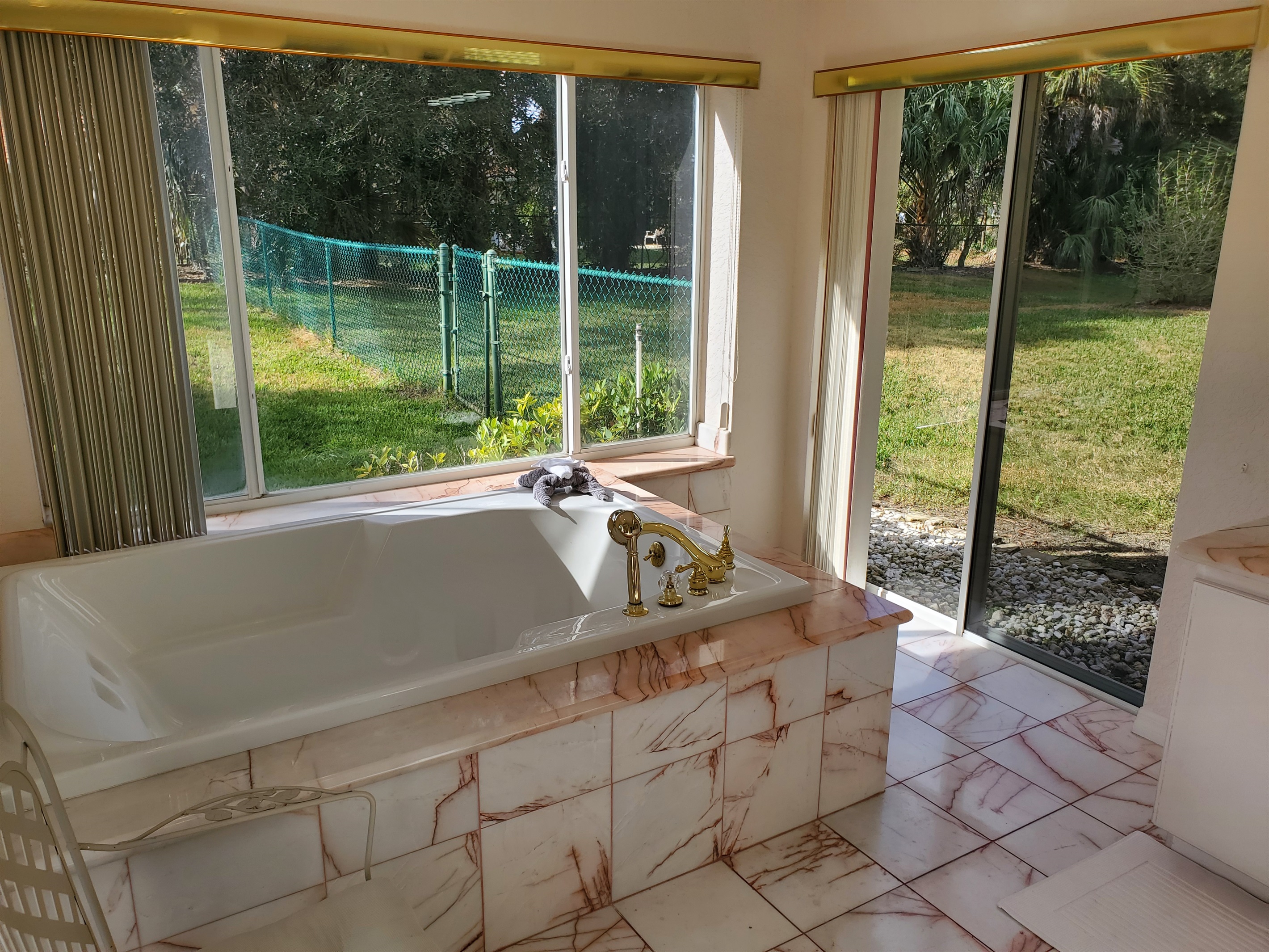 Master Queen bathroom with private bath, sink-in tub and walk in shower.