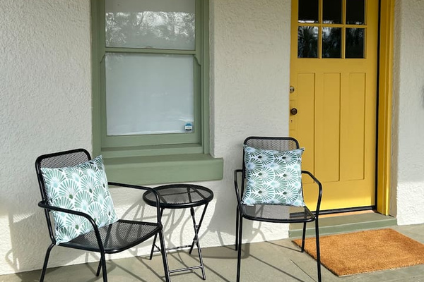 Front porch with chairs facing the sunset