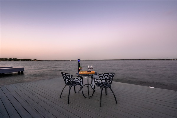 Toast to the moment as the sun sets over the water—your private dockside table awaits for unforgettable evenings.