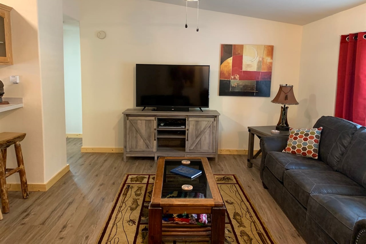 Living Room Space and Entry to Two Guest Bedrooms and Main Bath