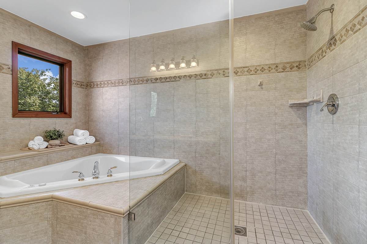 Upstairs Primary Bathroom Suite with jetted tub and walk-in shower
