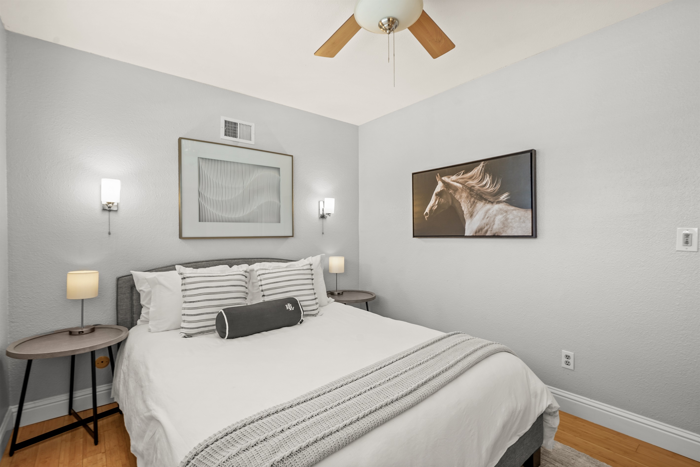 Comfortable upstairs bedroom with a queen bed and closet space for guest belongings.