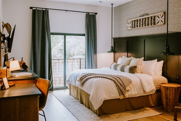 Homestead Suite &mdash; the ADA-accessible ground-floor king bedroom, included in your Gaines Ranch on the Square entire property reservation. Accessibility for every member of your group.
