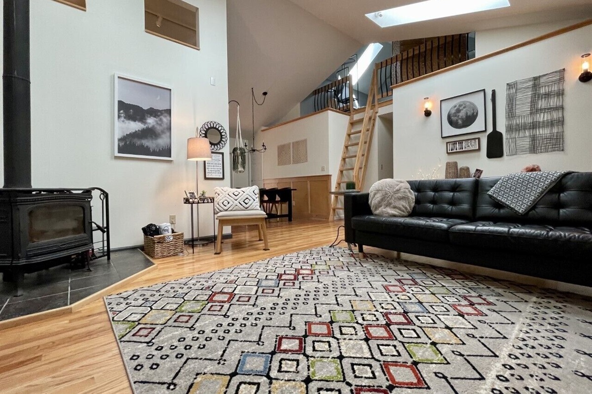 Looking towards the hall with three bedrooms below loft area