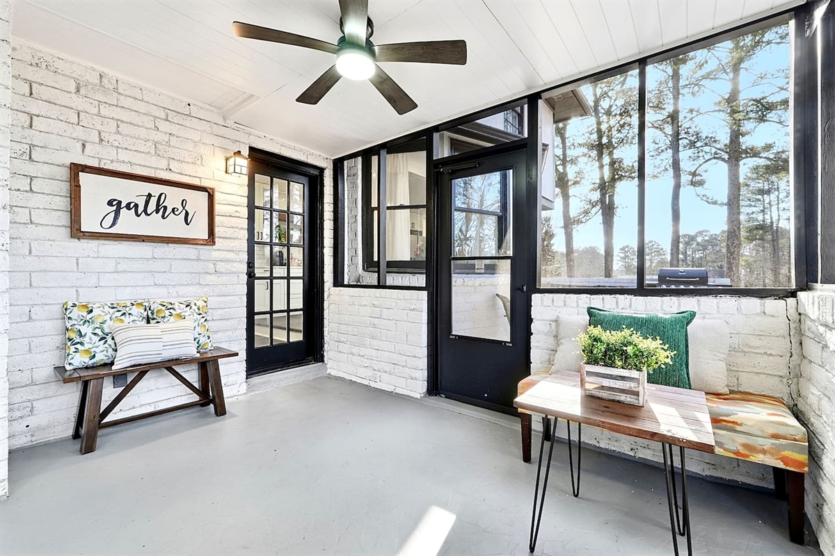Inviting and spacious sunroom featuring ample seating, perfect for relaxing, unwinding, or spending quality time together.