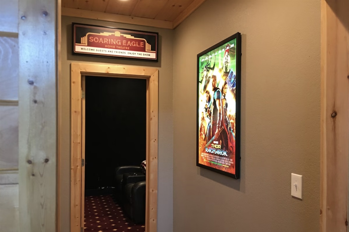 The entry to the Soaring Eagle Chalet Movie Theater, fit with a backlit movie poster!