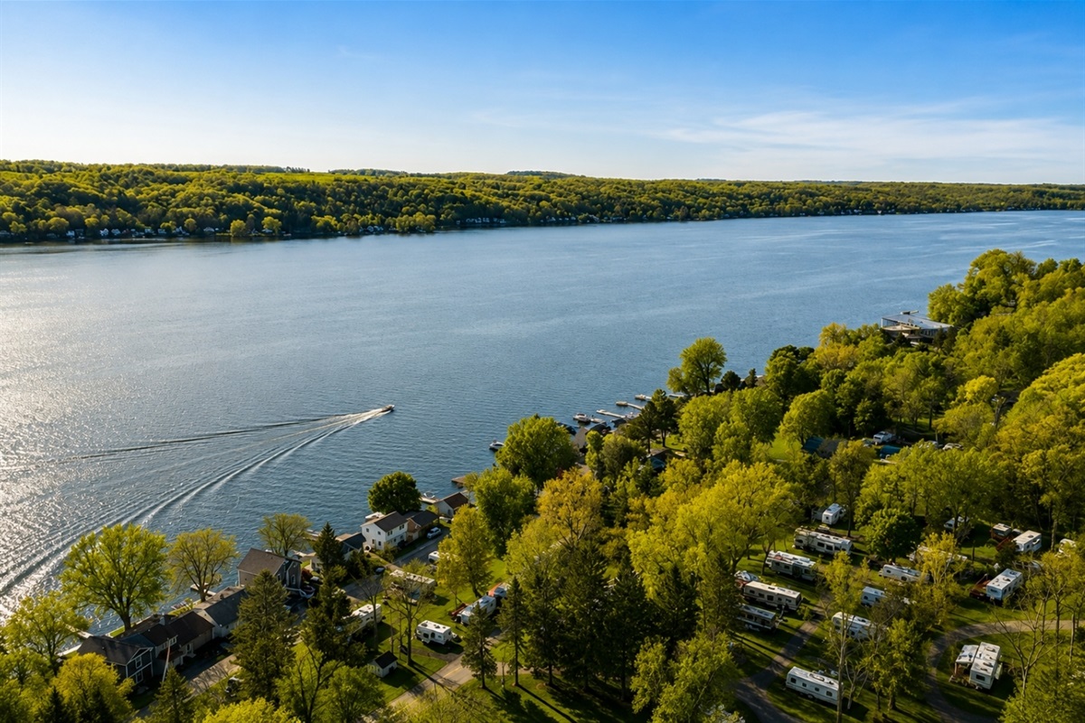 Discover this secluded lakeside haven, nestled amidst verdant foliage with sweeping views, offering privacy and natural beauty for a tranquil escape.