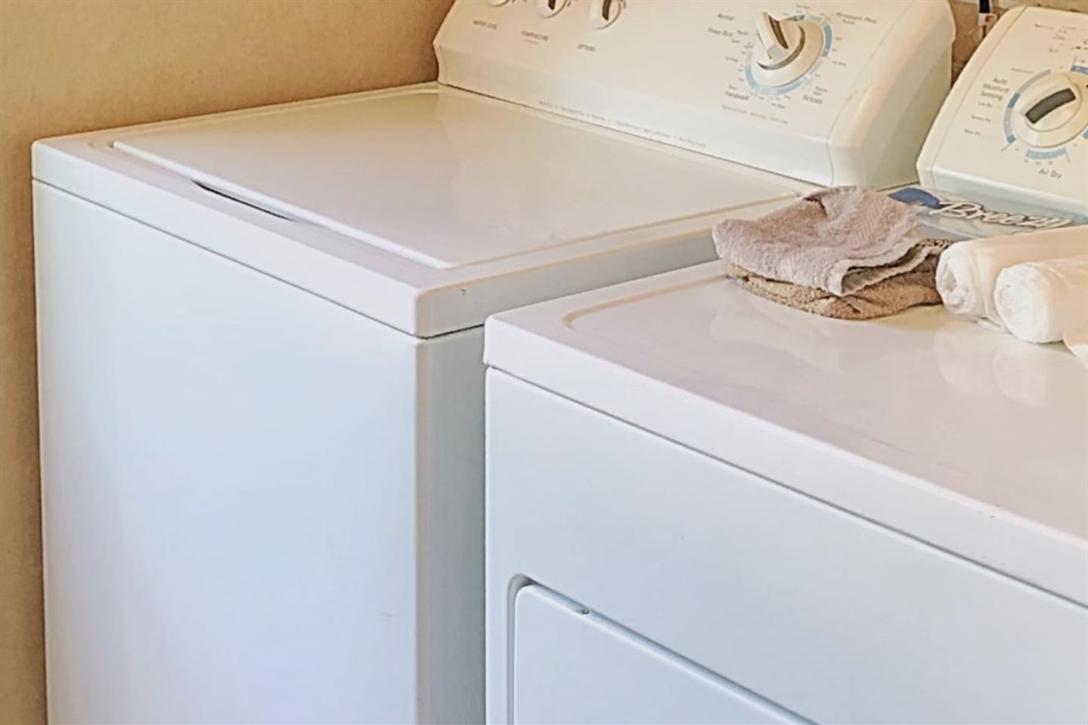 Washer and dryer in laundry room. 