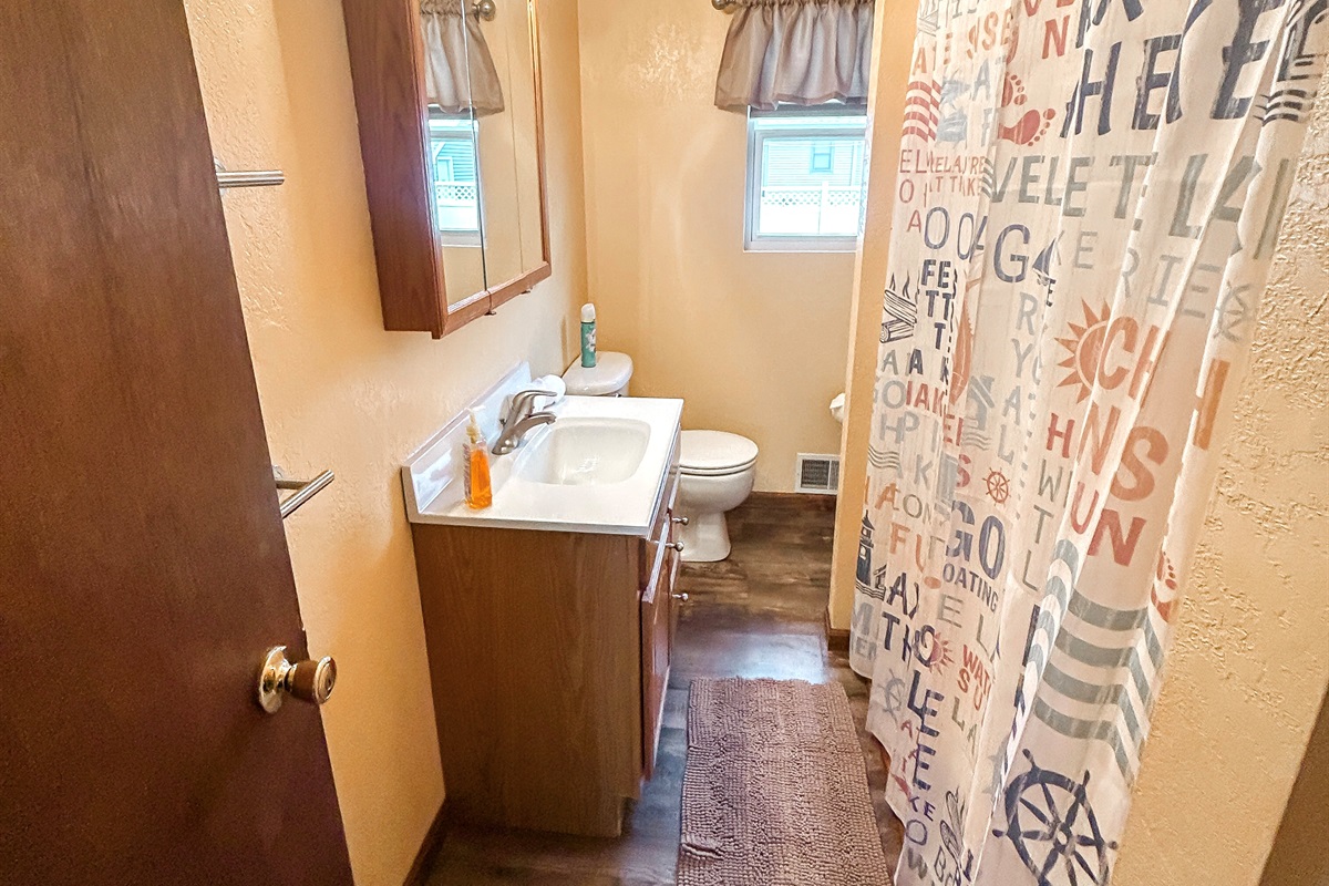 [Full Bathroom] Plenty of beach towels for your family are located here.