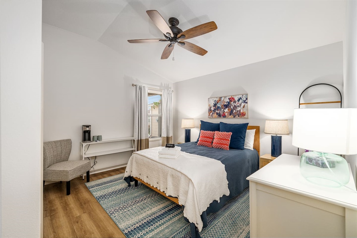 The second bedroom features a closet, clothing storage and a comfortable queen bed.  