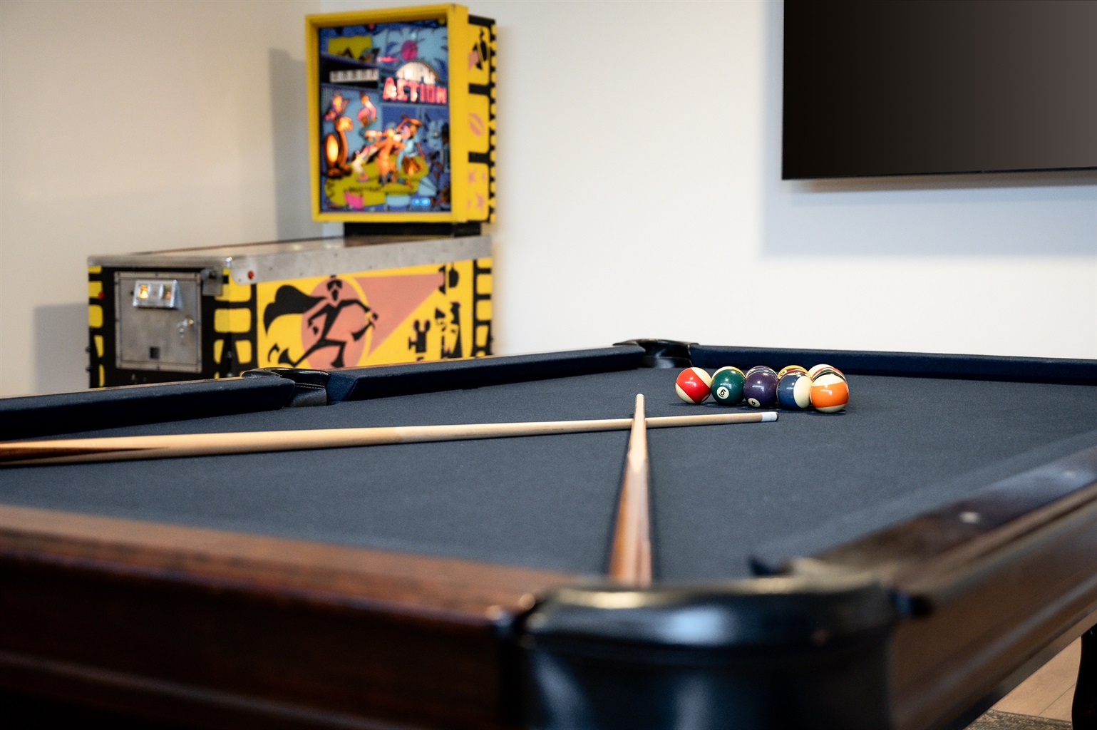 Game garage with arcade game (old school ping pong), & pool table with convertible tabletop with ping pong. Card table and variety of family games